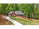 Beautiful brick home with an attached garage, long drive, and a well-manicured lawn at 125 Abner Dr, Mcdonough, GA 30252