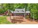 Attractive brick home featuring a cozy front porch in a serene, wooded setting at 125 Abner Dr, Mcdonough, GA 30252