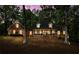 Charming brick home with a welcoming porch, dormer windows, and manicured landscaping at 125 Abner Dr, Mcdonough, GA 30252