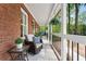 Cozy front porch featuring comfortable seating, decorative plants, and a charming exterior at 125 Abner Dr, Mcdonough, GA 30252