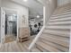 Hallway with a tiled bathroom, stairs, and access to a gym at 125 Abner Dr, Mcdonough, GA 30252