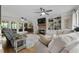 Comfortable living room with hardwood floors, fireplace, built-in shelving, and ample seating at 125 Abner Dr, Mcdonough, GA 30252