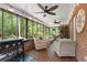 Covered screened porch with comfortable seating and an outdoor cooking area at 125 Abner Dr, Mcdonough, GA 30252