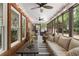Inviting screened porch features brick accents, string lights and comfortable seating arrangements, perfect for relaxation at 125 Abner Dr, Mcdonough, GA 30252