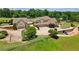 Aerial view of home with a large front yard, a circular driveway, and mature trees at 2220 Peachtree Rd, Cumming, GA 30041