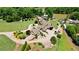 A sprawling estate with lush lawns, mature trees and landscaping, and lake access at 2220 Peachtree Rd, Cumming, GA 30041