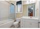 Bathroom with walk-in shower, updated vanity and natural lighting at 2220 Peachtree Rd, Cumming, GA 30041