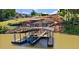 Two story dock featuring a gazebo, plenty of seating, and water access for boating and swimming at 2220 Peachtree Rd, Cumming, GA 30041