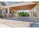 Spacious carport with wood ceilings, stone columns, and outdoor seating at 2220 Peachtree Rd, Cumming, GA 30041
