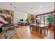 Stunning open floor plan with dining area, hardwood floors, and a view of the backyard at 2220 Peachtree Rd, Cumming, GA 30041