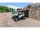 Driveway with a side-by-side utility vehicle parked near a stone wall at 2220 Peachtree Rd, Cumming, GA 30041