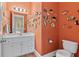 Whimsical powder room with fish wall decor and a white vanity at 2220 Peachtree Rd, Cumming, GA 30041