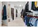 Spacious walk-in closet with custom shelving and hanging rods for organized storage at 2220 Peachtree Rd, Cumming, GA 30041