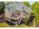 A backyard featuring a raised deck with outdoor seating and stairs to the ground level at 3233 Bagley Psge, Duluth, GA 30097
