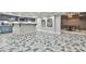 Basement area with a stone bar, patterned floors, and recessed lighting at 3233 Bagley Psge, Duluth, GA 30097
