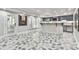 Large room with patterned flooring, bar area, and doorway to outdoor space at 3233 Bagley Psge, Duluth, GA 30097