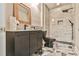 Contemporary bathroom with marble-tiled shower, black fixtures, a modern vanity, and patterned flooring at 3233 Bagley Psge, Duluth, GA 30097