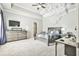 A cozy bedroom with a tray ceiling and carpeted floors at 3233 Bagley Psge, Duluth, GA 30097