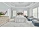 A cozy bedroom with a tray ceiling and neutral tones at 3233 Bagley Psge, Duluth, GA 30097