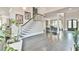 Grand foyer with hardwood floors, elegant staircase, and views to formal living room at 3233 Bagley Psge, Duluth, GA 30097
