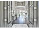 Grand foyer with soaring ceilings, dark hardwood floors and elegant architectural details at 3233 Bagley Psge, Duluth, GA 30097
