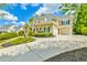 Traditional two-story home with a three-car garage, neutral stucco and lovely landscaping at 3233 Bagley Psge, Duluth, GA 30097