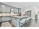Well-appointed kitchen with stainless appliances, a large island, and ample counter space at 3233 Bagley Psge, Duluth, GA 30097