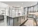 Entertain in this kitchen with great flow to living areas and generous lighting at 3233 Bagley Psge, Duluth, GA 30097