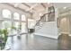 Bright living area featuring large windows, a staircase, and sophisticated decorative details at 3233 Bagley Psge, Duluth, GA 30097