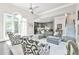 Relax in the generous living room with adjacent kitchen and dining spaces at 3233 Bagley Psge, Duluth, GA 30097