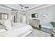 Main bedroom features light blue walls, trey ceilings, hardwood floors, and many windows at 3233 Bagley Psge, Duluth, GA 30097
