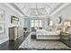 Bright main bedroom with large windows, a sitting area, and modern furnishings with hardwood floors and trey ceilings at 3233 Bagley Psge, Duluth, GA 30097