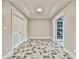 Open room with patterned flooring and doors on either side at 3233 Bagley Psge, Duluth, GA 30097