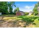 Spacious backyard featuring well maintained lawn and a detached garage at 1272 Saxony Se Dr, Conyers, GA 30013