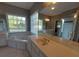 Large bathroom features a jetted tub, shower, double vanity and lots of counterspace at 1272 Saxony Se Dr, Conyers, GA 30013