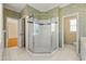 Spacious bathroom featuring glass enclosed shower and tile flooring at 1272 Saxony Se Dr, Conyers, GA 30013