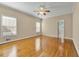 Spacious bedroom with hardwood floors, bright windows and ceiling fan at 1272 Saxony Se Dr, Conyers, GA 30013