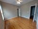 Light filled bedroom with hardwood floors, ceiling fan, and ample closet space at 1272 Saxony Se Dr, Conyers, GA 30013