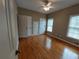 Bedroom featuring hardwood floors, a ceiling fan, and neutral wall color at 1272 Saxony Se Dr, Conyers, GA 30013