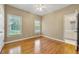 Cozy bedroom featuring hardwood floors, natural light, and an ensuite bathroom at 1272 Saxony Se Dr, Conyers, GA 30013