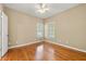 Cozy bedroom featuring gleaming hardwood floors and natural light from large windows at 1272 Saxony Se Dr, Conyers, GA 30013
