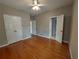 Inviting bedroom with natural light, hardwood floors and neutral paint at 1272 Saxony Se Dr, Conyers, GA 30013