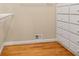Walk-in closet with white drawers and shelving for organization at 1272 Saxony Se Dr, Conyers, GA 30013