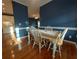 Charming dining area with hardwood floors, a tile-top table, and white trim at 1272 Saxony Se Dr, Conyers, GA 30013