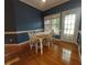 Sunny dining area with hardwood floors and natural light, perfect for Gathering meals at 1272 Saxony Se Dr, Conyers, GA 30013
