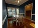 Dining area with blue walls, window, and access to laundry room at 1272 Saxony Se Dr, Conyers, GA 30013