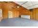 Interior view of detached garage featuring work space with cabinets and concrete floor at 1272 Saxony Se Dr, Conyers, GA 30013