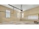 Spacious garage with neutral walls, two windows, and concrete flooring at 1272 Saxony Se Dr, Conyers, GA 30013
