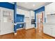 Bright eat-in kitchen offers white cabinetry, stainless appliances, and hardwood flooring at 1272 Saxony Se Dr, Conyers, GA 30013