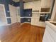 Bright kitchen features white cabinetry, hardwood floors, and recessed lighting at 1272 Saxony Se Dr, Conyers, GA 30013